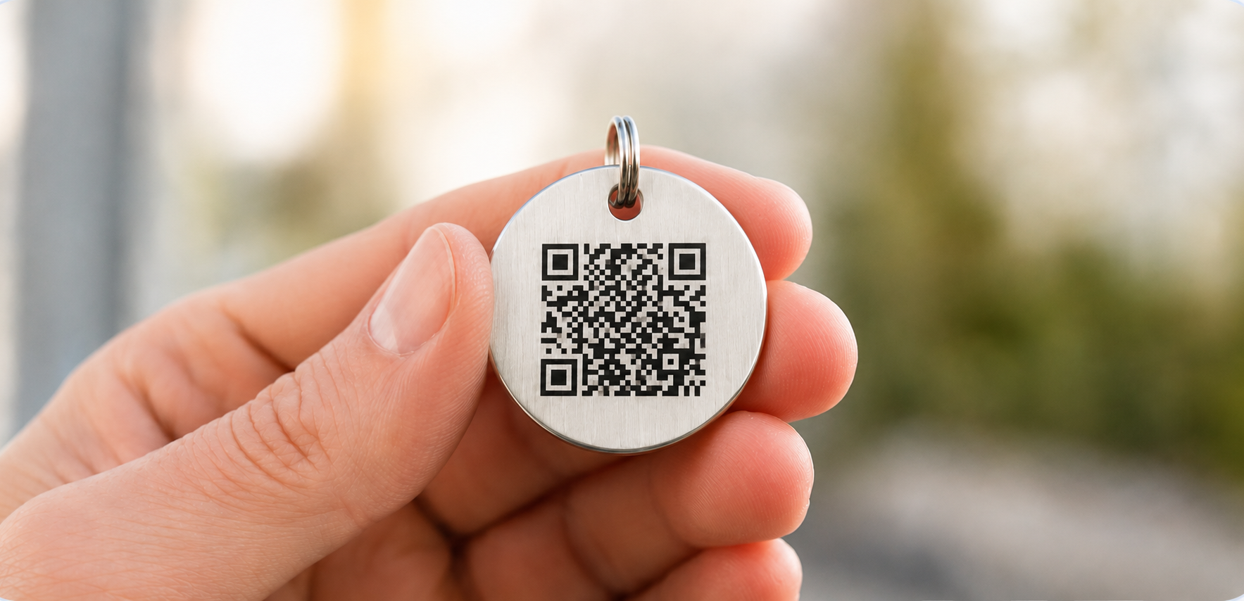 Hand holding a HomeSafePet QR tag
